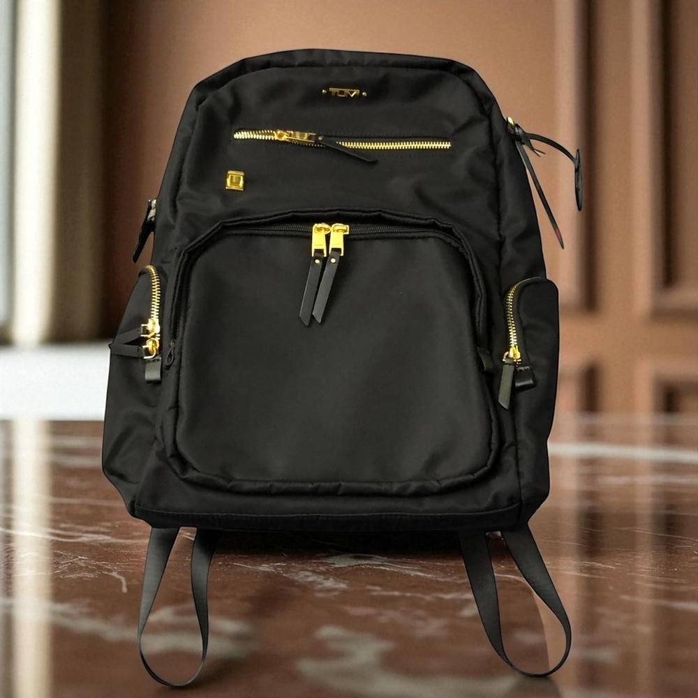 Tumi ✨Black and Gold Backpack✨ with Modern Design